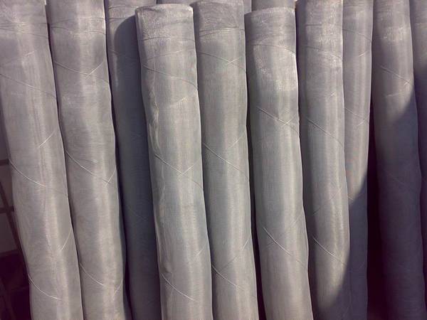 Many aluminum insect screen rolls tied with metal wire