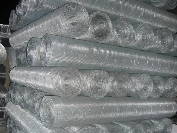 Aluminum woven wire mesh rolls in warehouse