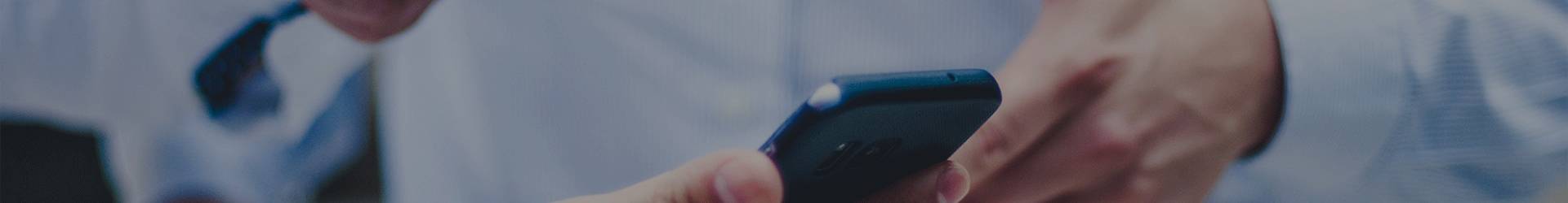 A man is holding a mobile phone.