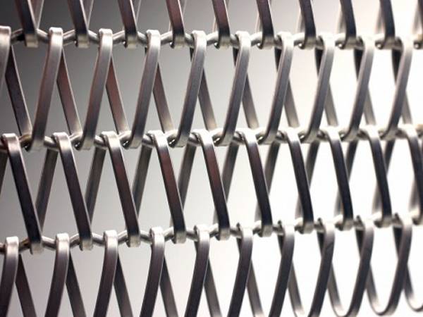 A piece of aluminum conveyor belt made from flat spiral wire and straight round cross rod